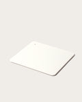 The minimalist white Gather 2x2 Base Plate with rounded corners and a small hole in one corner rests on a light gray surface, complementing the sleek magnetic Gather modules.