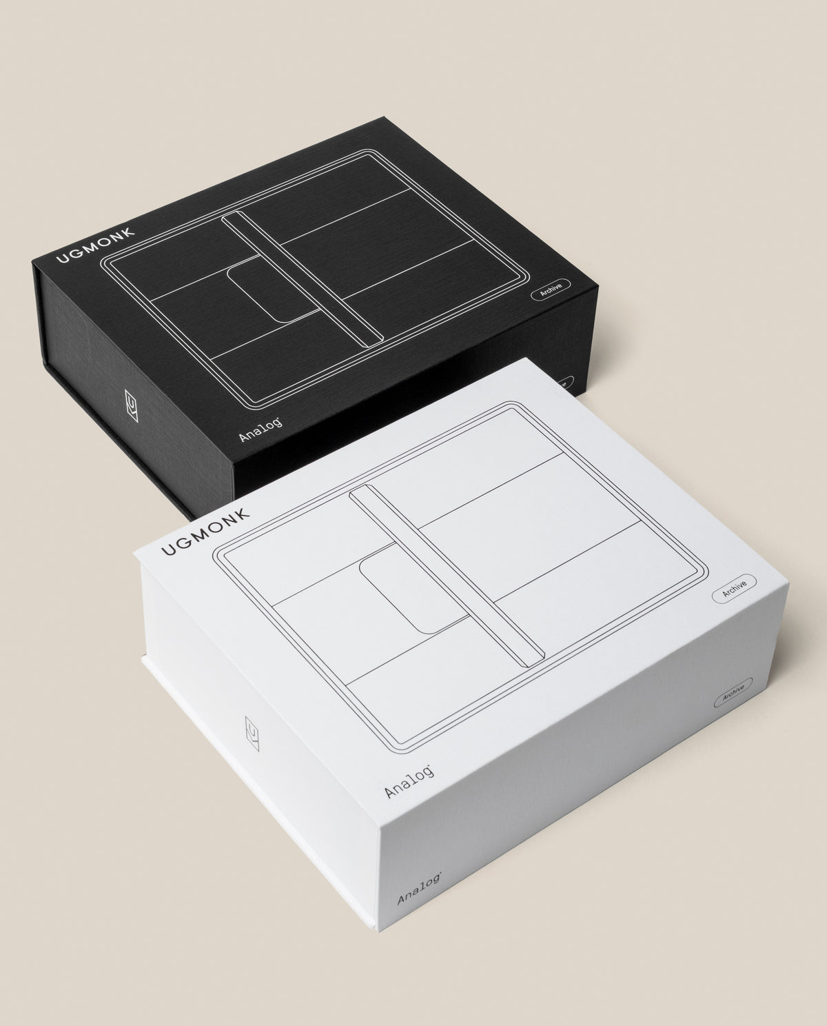 A black and a white Analog Archive (Black Aluminum) rectangular box, each featuring a line drawing of an analog card organizer on the lid.