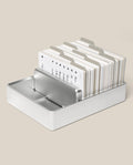 An Analog Archive (Silver Aluminum) card holder filled with tabbed index cards.