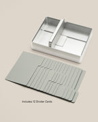 Analog Archive (Silver Aluminum) card holder with a center divider, accompanied by a set of twelve gray divider cards for desk card archiving.