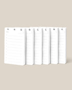 Six white Discbound Analog Refill notepads (6-pack) with blank lines and checkboxes are arranged side by side on a beige background. Each notepad features a top cutout, ideal for hanging, binding, or use as discbound refill cards.