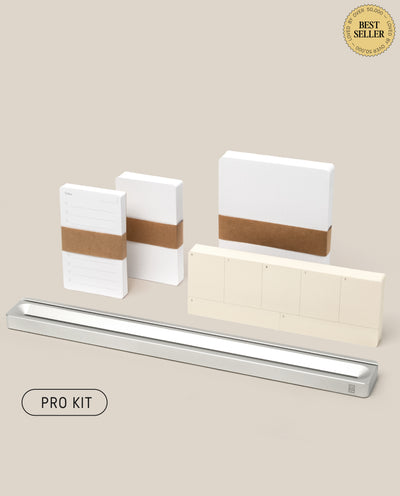 The Analog Card Bar - Pro Kit (Silver) features stacks of white task cards with brown paper bands, a silver pen tray, and a BEST SELLER badge on a beige background—ideal for organizing your workspace.