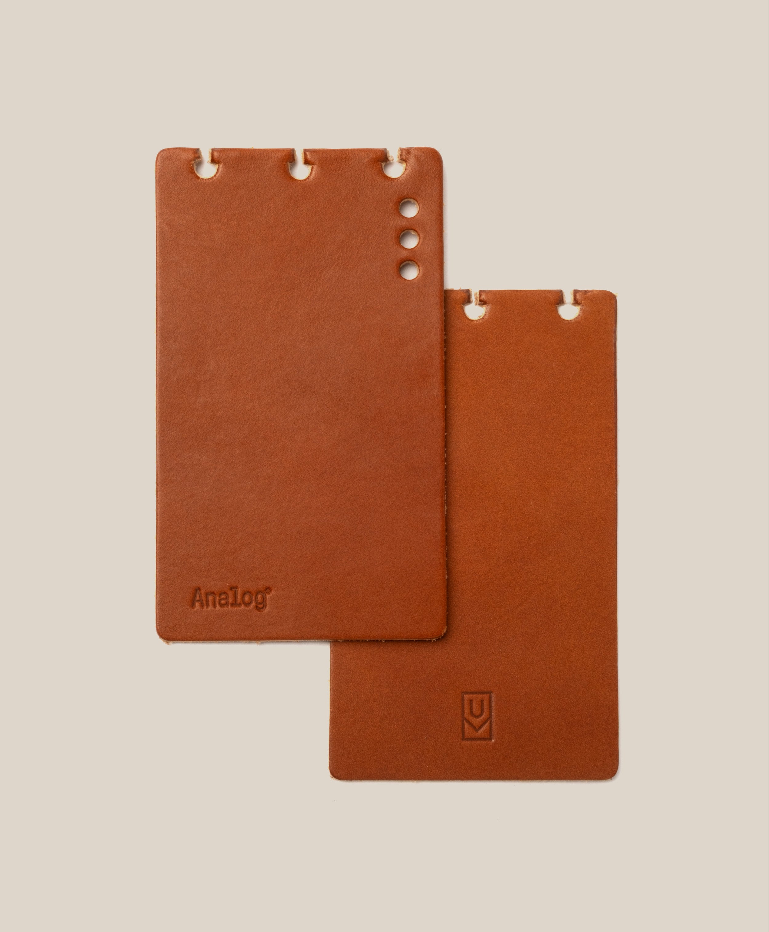 *Covers Only* – Leather Discbound Analog (Tan) includes two full-grain leather covers with rounded corners and 3 or 4 punched holes. One is embossed with "AnaLog," the other features a small symbol. Both are made in USA; beige background shown.