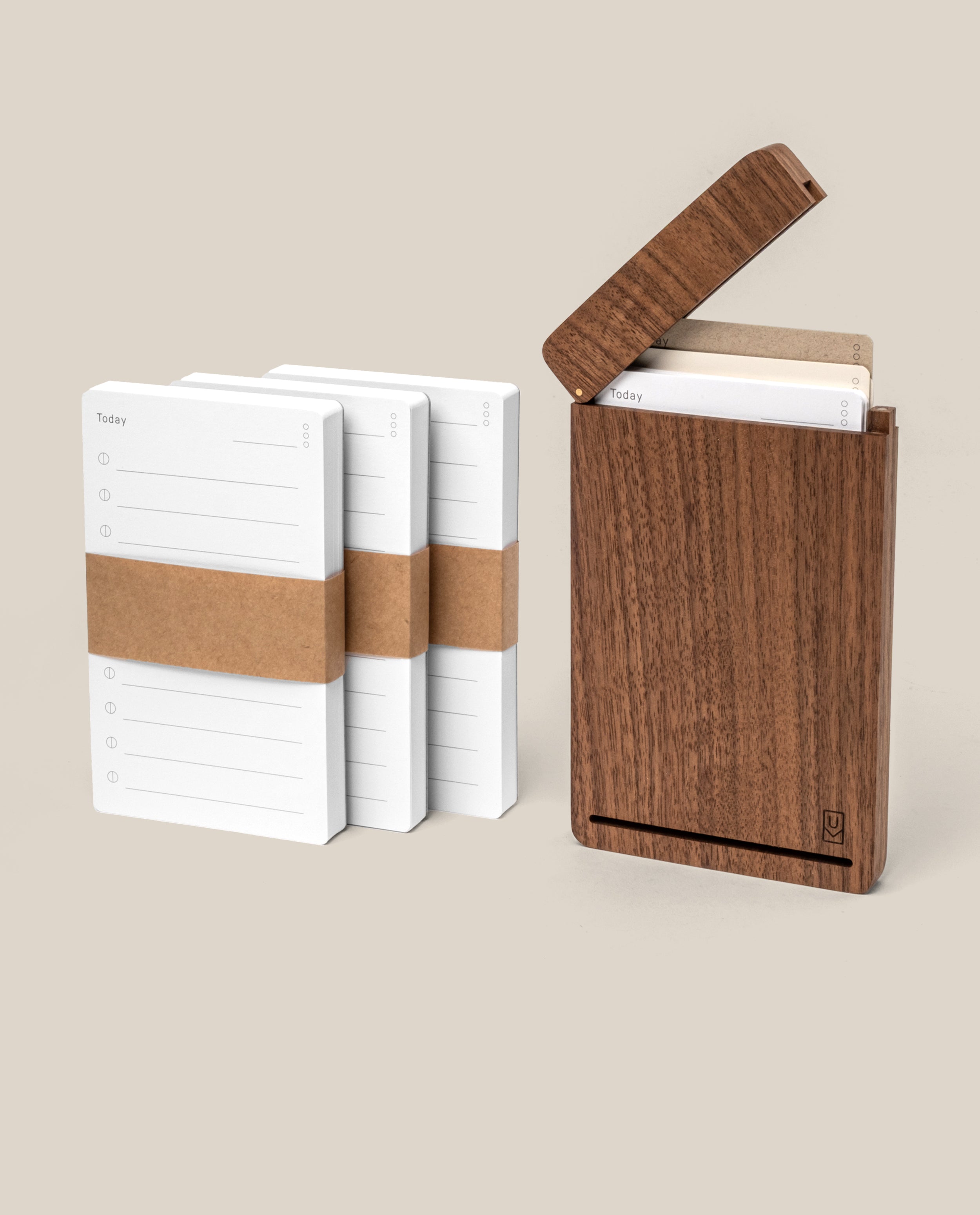 The Analog Travel Case + 3 Card Packs (Walnut) features three stacks of white task cards with brown bands beside an open premium walnut case holding matching notecards, all displayed on a beige background.
