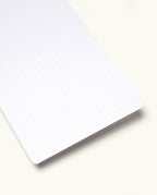 A close-up of an Analog - Today Card, a white rectangular sheet featuring faint dotted grid lines and rounded corners, placed on a light background—perfect for implementing your productivity system or using as analog cards for effective task prioritization.