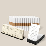 The Analog Annual Kit (Black Aluminum) is displayed with white lined notecards—some bound with brown paper bands—and features a black Weekly Card Holder and Daily Card Holder showcasing handwritten notes and a daily to-do list.