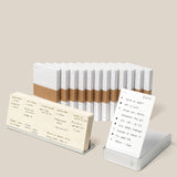 The Analog Annual Kit (Silver Aluminum) features stacked white notepads with brown bands and a card-style notepad in a clear, angled Weekly Card Holder, all presented on a neutral background.