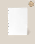 A smooth, blank white page of paper with disc binding on the left, set against a beige background. A circle in the top right corner reads “Blank”—making this Discbound Journal Refill - Blank (Standard 6″ x 8.5″) the ideal replacement paper pack for your Heirloom Discbound Journal.