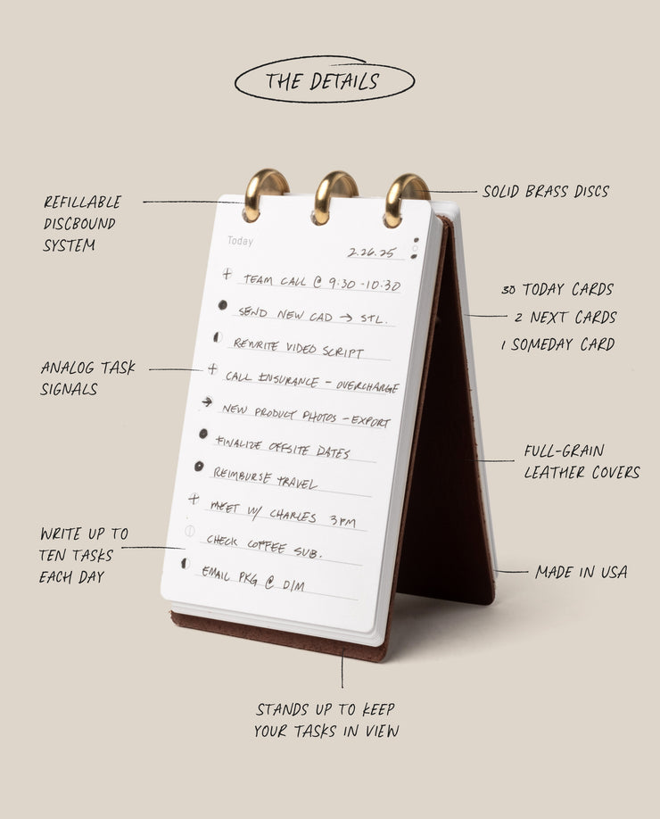 Desk calendar with features listed on a beige background