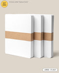 Three Analog Dot Grid Cards - Large (3-Pack) are stacked and secured with brown paper bands on a light beige background. A label displays their LARGE 5” x 6.5” size, making them ideal for note taking.