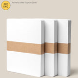 Three Analog Dot Grid Cards - Large (3-Pack) are stacked and secured with brown paper bands on a light beige background. A label displays their LARGE 5” x 6.5” size, making them ideal for note taking.