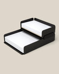 The Capture Bundle (Small Tray + Large Tray - Black Steel) is a two-tiered, stackable set holding plain paper on the bottom tray and lined sheets on the upper tray, shown against a neutral background.