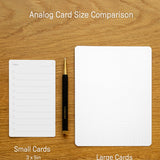 Two analog cards sit on a wooden surface: a lined 3x5" notecard and an Analog Dot Grid Card - Small (from the 12-Pack, 5x6.5"). A pen rests between them for scale, with text labels showing each card’s size.