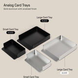 Shown are four anodized aluminum card trays—two small (one black, one silver) and two large (one black, one silver)—each labeled by size/color. The small silver tray pairs perfectly with your Analog Capture Kit - Small (Silver Aluminum).