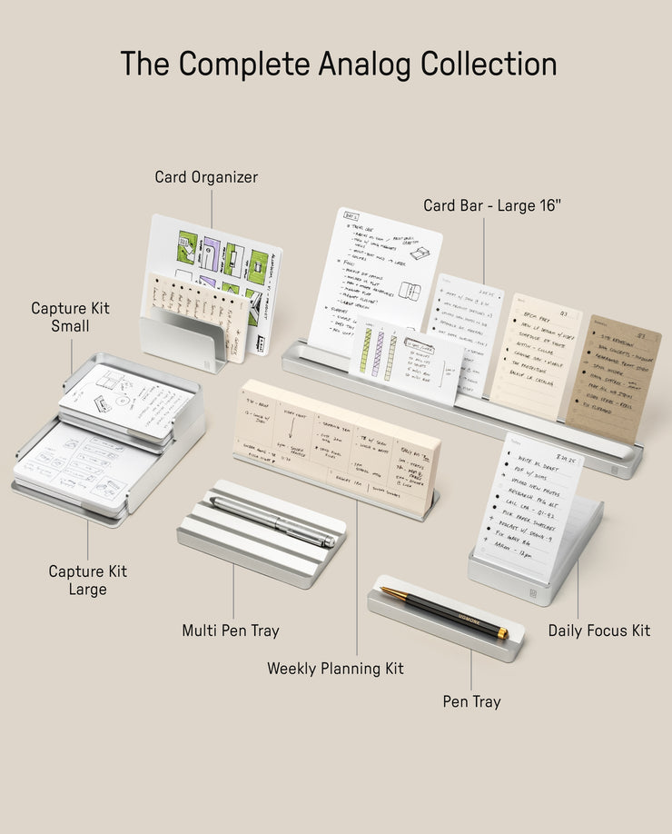 A display of The Complete Analog Collection (Silver Aluminum)—including card organizers, capture kits, pen trays, and a weekly planning kit—arranged neatly on a light surface with labeled descriptions.