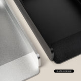 Close-up of two rectangular metal trays, one in silver and one in black aluminum, side by side on a light surface; the silver tray is the Analog Daily Focus Kit (Silver Aluminum) with labeled colors.