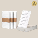 Four stacks of Analog Daily Focus Kit + 3 Refills (Silver Aluminum) task cards are shown; one stack sits in a sleek silver aluminum holder displaying a handwritten to-do list. A #1 Best Seller badge appears in the top right corner.
