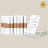 The Analog Daily Focus Kit + 6 Refills (Silver Aluminum) features a stack of six notepads wrapped in brown paper beside a single displayed notepad with a handwritten to-do list and a #1 Best Seller badge on a beige background.