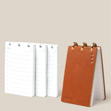 The Leather Discbound Analog + 3 Refills (Tan) features a tan full-grain leather notepad with gold disc rings, shown standing upright beside three stacks of loose refills on a beige background.
