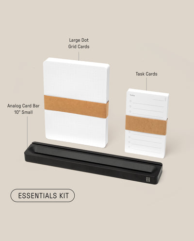 Photo of the Analog Card Bar - Essentials Kit (Black Aluminum), featuring a stack of large Dot Grid Cards, Task Cards, and a sleek black card bar stand, all labeled against a beige background.