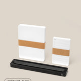 The Analog Card Bar - Essentials Kit (Black Aluminum) includes a large dotted notepad, a to-do list notepad, and a sleek black pen holder on a light beige background—modern essentials for any desk.