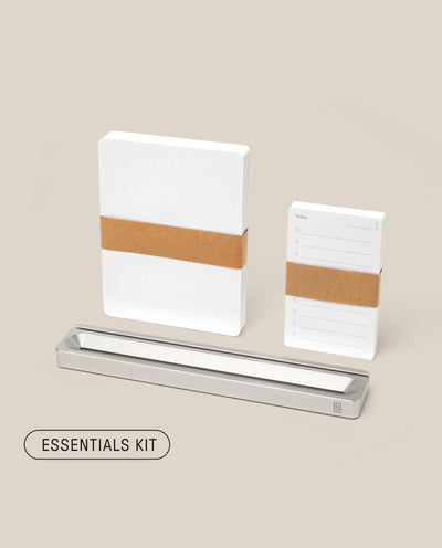 Analog Card Bar - Essentials Kit (Silver Aluminum) includes two notepads with brown bands, a sleek silver aluminum desk organizer, and a matching pen tray, all displayed on a light beige background. Text reads: ESSENTIALS KIT.