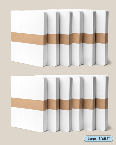 Twelve Analog Dot Grid Cards - Large (5 x 6.5) are displayed in two rows of six, each with a brown paper band and a label at the lower right corner. They rest on a light beige background, highlighting their premium card stock quality.