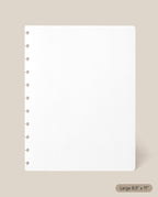 A Large Discbound Journal Refill - Dot Grid (8.5″ x 11″) page in crisp white, featuring round disc-binding holes along the left side and a subtle label in the corner that reads “Large 8.5″ x 11″,” is displayed on a beige background—ideal for refilling your discbound journal.