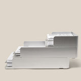 Two large silver aluminum Analog Capture Kit trays are shown stacked, each holding dot grid cards. Text below reads: Stackable design allows you to stack multiple trays together.