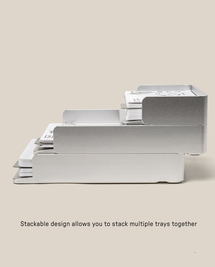 Two large silver aluminum Analog Capture Kit trays are shown stacked, each holding dot grid cards. Text below reads: Stackable design allows you to stack multiple trays together.