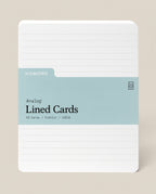 A pack of Analog Lined Cards - Large features a light blue label with details: 50 cards, 5 x 6.5 inches, uncoated cardstock, rounded corners, and horizontal lines—ideal for sketching and note-taking.