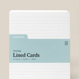 A pack of Analog Lined Cards - Large features a light blue label with details: 50 cards, 5 x 6.5 inches, uncoated cardstock, rounded corners, and horizontal lines—ideal for sketching and note-taking.