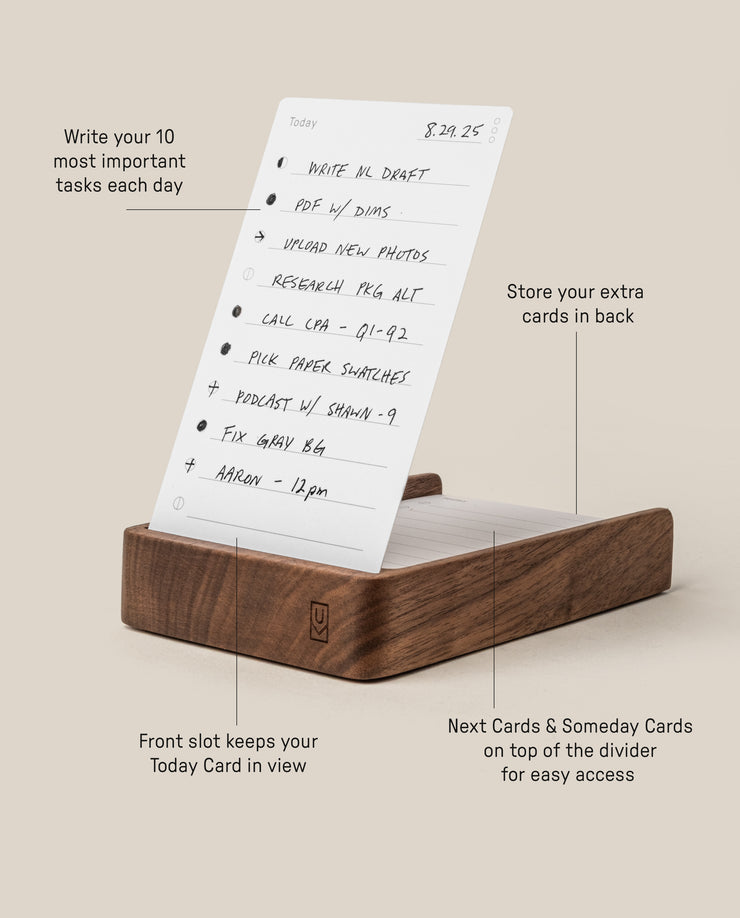 The Analog Daily Focus Kit (Walnut) features a wood card holder that displays handwritten task cards—the front slot is for Today Cards, extra cards fit in back, and the top divider holds Next and Someday Cards for intuitive productivity.