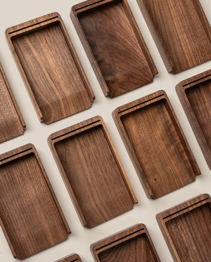 Rectangular walnut trays with raised edges are arranged neatly, highlighting the rich wood grain—perfect for organizing your Analog Annual Kit (Walnut) and showcasing its warm tones on a light surface.