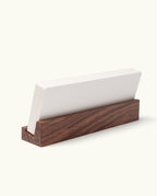 The Analog Annual Kit (Walnut) features a stack of white cards neatly held upright in a rectangular walnut holder, set against a plain white background. Designed for organizing your workflow, this timeless kit keeps your daily and weekly cards easily accessible.