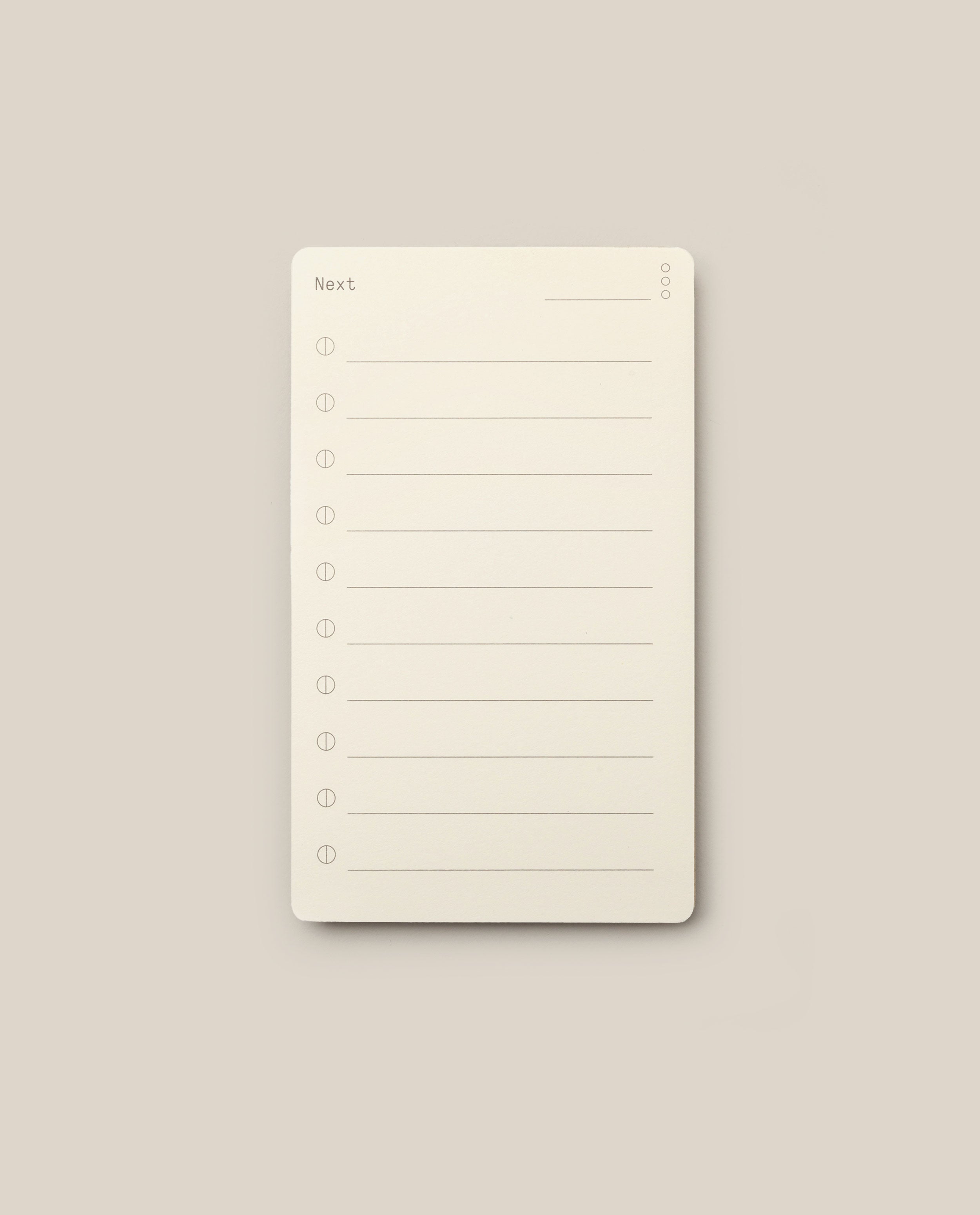 Analog - Next Cards: Notepads featuring the word “Next” at the top and eight numbered lines for writing tasks or notes, set against a plain beige background—perfect for goal setting or capturing ideas on Analog - Next Cards.