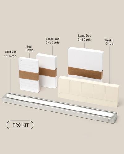 The Analog Card Bar - Pro Kit (Silver) is neatly arranged with 16" silver bar, Task Cards stacks, small/large Dot Grid Cards, and weekly cards labeled above on a light beige background.