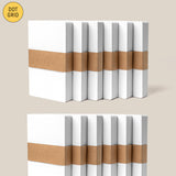 Twelve small Analog Dot Grid Cards (3x5, white) from the 12-pack are stacked in two rows, bundled with brown paper bands on a soft beige background—ideal for analog note-taking or as index cards.