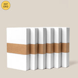 Six Analog Dot Grid Cards - Small (6-Pack) are stacked upright, wrapped with a brown paper band. A yellow “DOT GRID” and black “SMALL – 3 x 5” label appear in the corners—perfect for analog note-taking or as dot grid index cards.