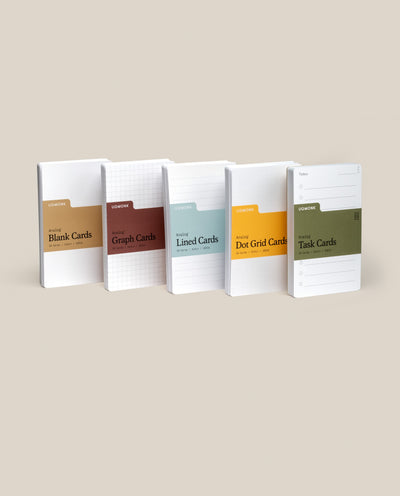 Five Analog Card Variety Pack - Small notebooks stand upright, displaying Blank, Graph, Lined, Dot Grid, and Task Cards—each distinguished by a unique color accent against a neutral background.
