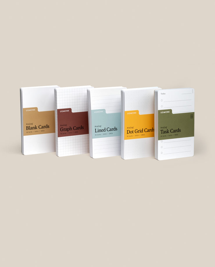 Five Analog Card Variety Pack - Small notebooks stand upright, displaying Blank, Graph, Lined, Dot Grid, and Task Cards—each distinguished by a unique color accent against a neutral background.
