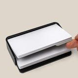 A hand slides a divider card between two stacks of cards in the Analog Capture Kit - Small (Black Aluminum). Text below reads: Included divider card to separate new and used cards.