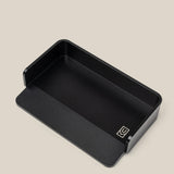 The Analog Capture Kit - Small (Black Aluminum) is a black rectangular aluminum card tray with rounded corners, a low front edge, and a small white geometric logo—ideal for organizing your Small Dot Grid Cards against any backdrop.