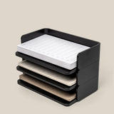 The Analog Capture Kit - Small (Black Aluminum) features stackable trays holding colorful notepads and Small Dot Grid Cards, showing how multiple trays can be organized together. Text below: Stackable design lets you stack several trays as needed.