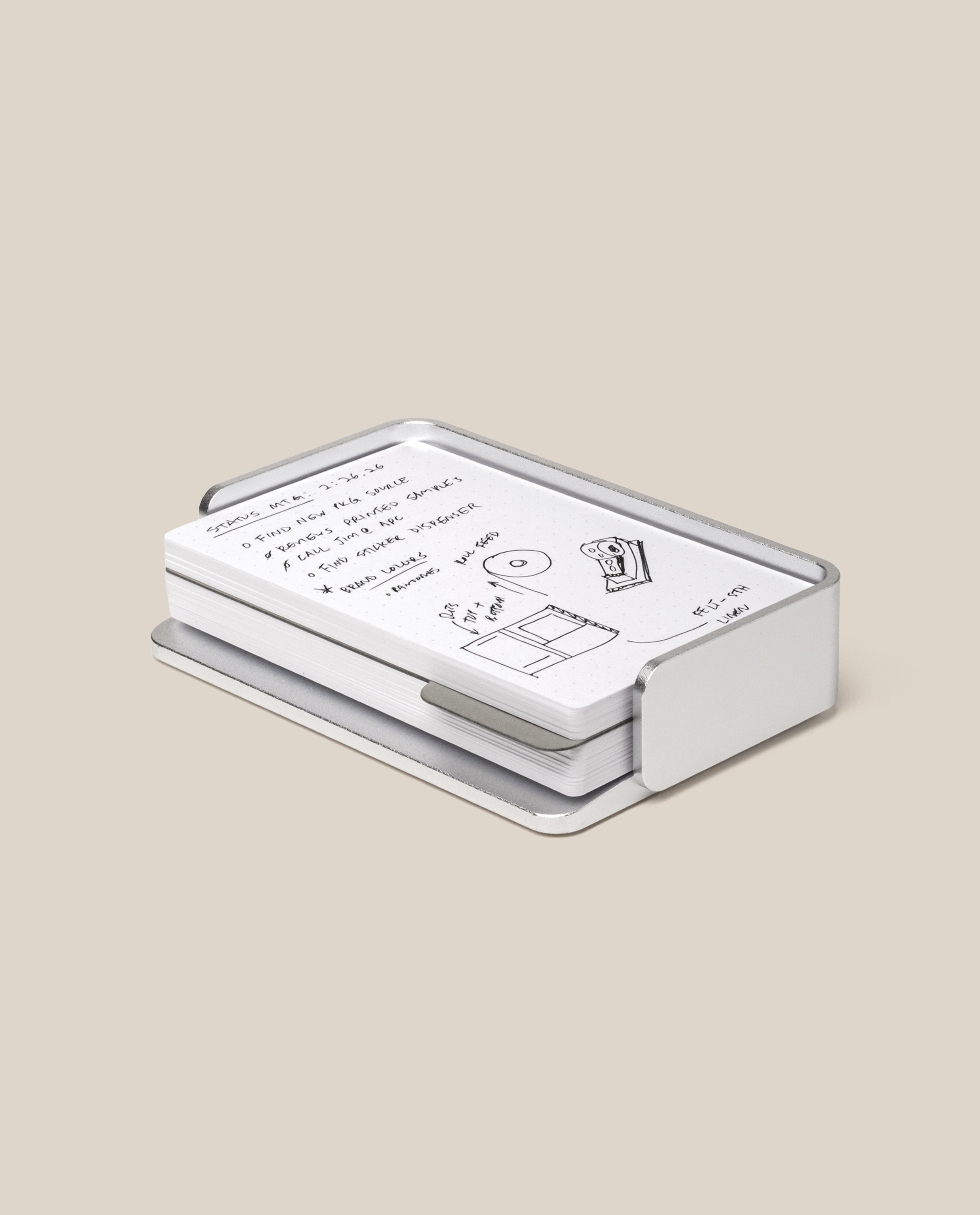 The Analog Capture Kit - Small (Silver Aluminum) features white dot grid cards with black handwritten notes and drawings, neatly arranged in a sleek silver aluminum tray on a plain beige background.