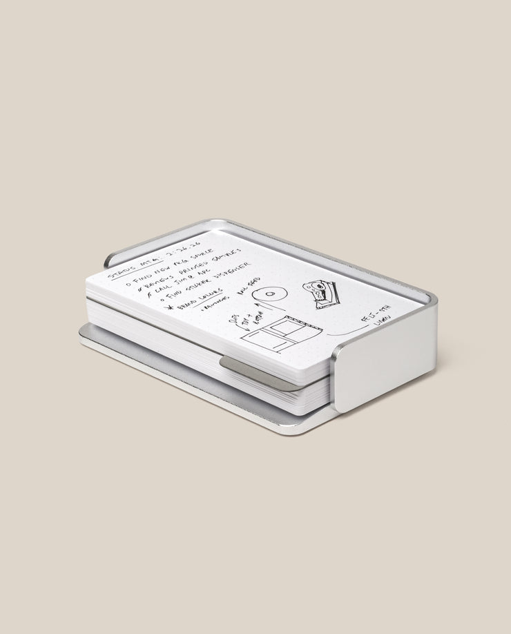 The Analog Capture Kit - Small (Silver Aluminum) features white dot grid cards with black handwritten notes and drawings, neatly arranged in a sleek silver aluminum tray on a plain beige background.