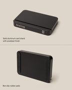 A front and back view of the Analog Starter Kit (Black), a solid aluminum card stand with an anodized finish and minimalist design. The back showcases non-slip rubber pads, and the stand is designed to seamlessly support your paper card system or task cards.