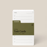 A stack of Analog Task Cards - Small with a minimalist design, made from uncoated 3x5" 100lb cardstock, includes spaces for tasks and a green label showing 33 cards.