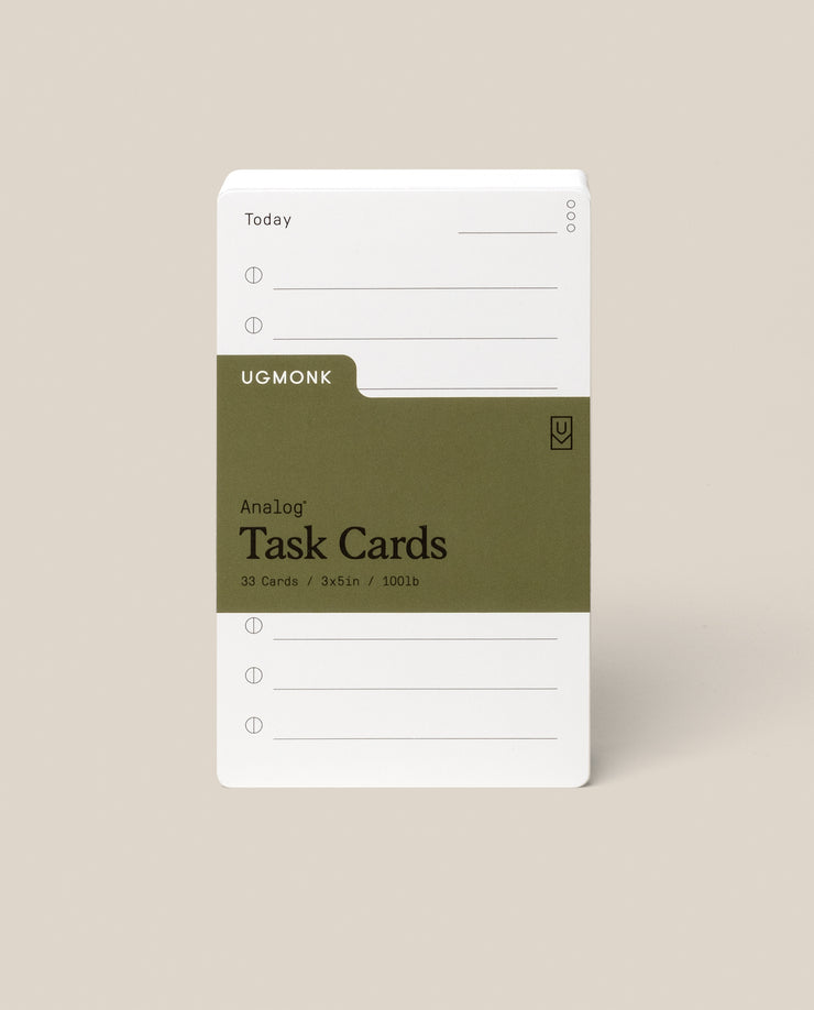 A stack of Analog Task Cards - Small with a minimalist design, made from uncoated 3x5" 100lb cardstock, includes spaces for tasks and a green label showing 33 cards.