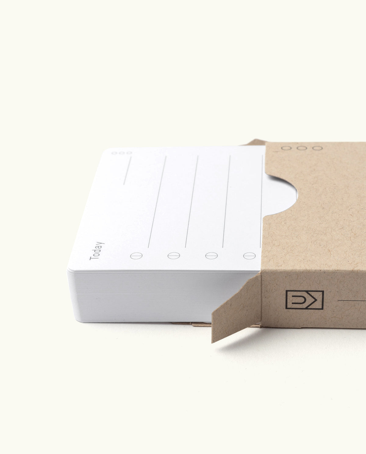 A stack of Analog - Today Cards, featuring white notecards with lines and circles labeled “Today,” is partially slid out from a brown, partially opened cardboard box on a light background—perfect for building an analog Productivity System and streamlining daily task prioritization.